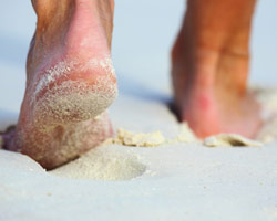 Close up of feet on beach